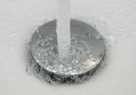 SCHWELM - JANUARY 10: Water pours down the drain of a washbasin on January 10, 2007 in Schwelm, Germany. (Photo Illustration by Christof Koepsel/Getty Images)