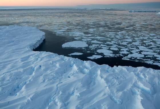 VINCENNES BAY, ANTARTICA - JANUARY 11: Giant tabular icebergs are surrounded by ice floe drift in Vincennes Bay  on January 11, 2008 in the Australian Antarctic Territory. Australia's CSIRO's atmospheric research unit has found the world is warming faster than predicted by the United Nations' top climate change body, with harmful emissions exceeding worst-case estimates.  (Photo by Torsten Blackwood - Pool/Getty Images)