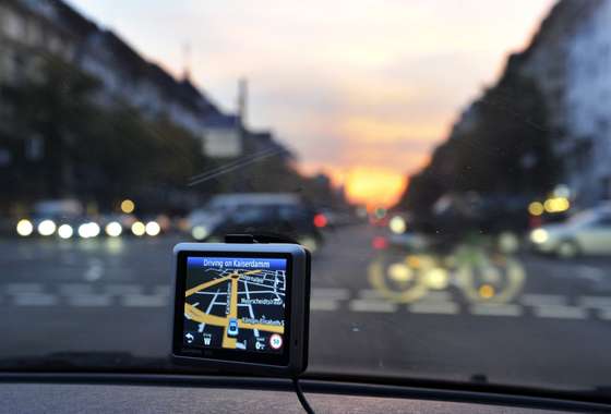 Directions are shown on a GPS unit mounted in a car travelling along Kaiserdamm at dusk in Berlin, October 8, 2010. AFP PHOTO / ODD ANDERSEN (Photo credit should read ODD ANDERSEN/AFP/Getty Images)