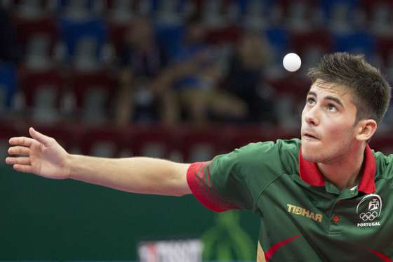 Portugal's Joa Geraldo serves to France's Emmanuel Lebesson  during the table tennis men's team Gold medal match France vs Portugal at the 2015 European Games in Baku on June 15, 2015. AFP PHOTO / JACK GUEZ        (Photo credit should read JACK GUEZ/AFP/Getty Images)