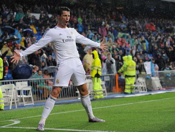 MADRID, SPAIN - MARCH 29:  Cristiano Ronaldo of Real Madrid FC celebrates after scoring his team's opening goal during the La Liga match between Real Madrid CF and Rayo Vallecano de Madrid at Santiago Bernabeu stadium on March 29, 2014 in Madrid, Spain.  (Photo by Denis Doyle/Getty Images)