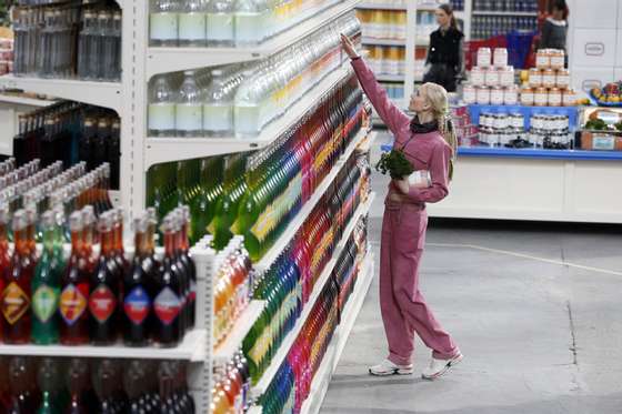 A model walks in a supermarket set up for the Chanel 2014/2015 Autumn/Winter ready-to-wear collection fashion show, on March 4, 2014 at the Grand Palais in Paris. AFP PHOTO / PATRICK KOVARIK (Photo credit should read PATRICK KOVARIK/AFP/Getty Images)