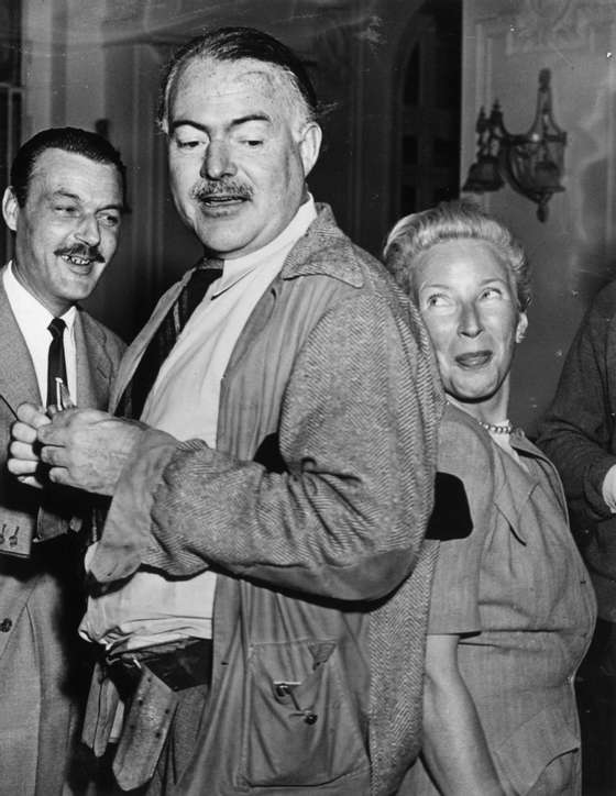 1948: Author and journalist Ernest Miller Hemingway (1899 - 1961) (with his wife, Mary) on holiday in Stresa, Italy. (Photo by Keystone/Getty Images)