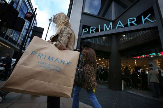 LONDON, ENGLAND - NOVEMBER 05:  A customer waits with her purchases outside Primark's flagship store on Oxford Street on November 5, 2014 in London, England. Retail giant Marks and Spencer have shown a continued decline in clothes sales as budget fashion chain Primark has delivered a 16% increase in its sales.  (Photo by Peter Macdiarmid/Getty Images)