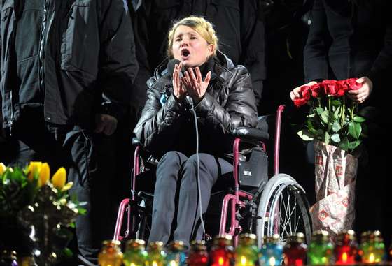 Newly freed Ukrainian opposition icon and former prime minister Yulia Tymoshenko delivers a speech on Kiev's Independence square on February 22, 2014. Ukraine's opposition leader and former premier Yulia Tymoshenko, sentenced to a seven-year jail term in 2011 for abuse of power, was released on February 22. Tymoshenko received a rapturous welcome on Independence Square. "You are heroes, you are the best of Ukraine," she told the 50,000-strong crowd before breaking down in tears. The latest developments in the ex-Soviet nation's three-month political crisis came after protesters took control of Kiev's charred city centre and seized Yanukovych's lavish residence on a day of dramatic twists and turns. AFP PHOTO / GENYA SAVILOV (Photo credit should read GENYA SAVILOV/AFP/Getty Images)