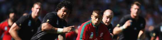 LYON, FRANCE - SEPTEMBER 15: Goncalo Malheiro of Portugal breaks throught the New Zealand defence during match fourteen of the Rugby World Cup 2007 between New Zealand and Portugal at the Gerland Stadium on September 15, 2007 in Lyon, France. (Photo by Ross Land/Getty Images)