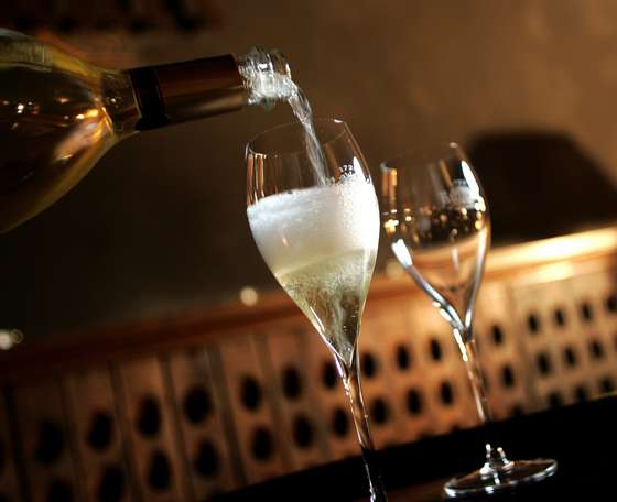 A glass of Champagne is served for a tasting, on December 11, 2008 at the producer Ruinart's cellars in Reims, northeastern France. The once sparkling shipments of France's premium export Champagne have dropped 4,9% during the first 10 months of the year, according to professionnals, but strong sales continue in emerging countries. AFP PHOTO ALAIN JULIEN (Photo credit should read ALAIN JULIEN/AFP/Getty Images)