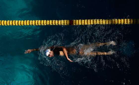 SANTA CLARA, CA - JUNE 22: Michael Phelps swims in the warm up pool during the 2014 Arena Grand Prix of Santa Clara at the George F. Haines International Swim Center on June 22, 2014 in Santa Clara, California. (Photo by Ezra Shaw/Getty Images)