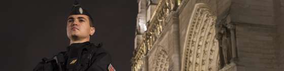 A French gendarme enforcing the Vigipirate plan, France's national security alert system, is pictured on November 19, 2015 in front of the Notre-Dame cathedral in Paris. France revealed on November 19 it will spend an extra 600 million euros (USD 641 million) next year to ramp up security after the Paris attacks. President Francois Hollande announced this week that France is freezing plans to cut troop numbers through 2019. At the same time, the country will add 8,500 law enforcement jobs including 5,000 new police. AFP PHOTO / JOEL SAGET (Photo credit should read JOEL SAGET/AFP/Getty Images)