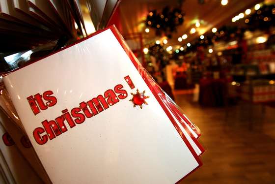 LONDON - AUGUST 07: Christmas cards are displayed with Christmas themed merchandise at Harrods in Knightsbridge for the launch of the store's 'Christmas World' on August 7, 2007 in London, England. (Photo by Rosie Greenway/Getty Images)