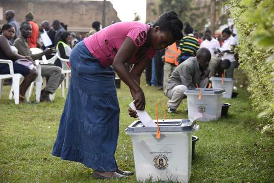 A woman casts her vote in presidential and parliamentary polls, on February 18, 2016 at the Nasuti polling station in Mukono District, some 23 kilometres east of the capital Kampala. Ugandans began voting on February 18 in presidential and parliamentary polls, with veteran leader Yoweri Museveni widely expected to extend his power into a fourth decade. / AFP / ISAAC KASAMANI (Photo credit should read ISAAC KASAMANI/AFP/Getty Images)