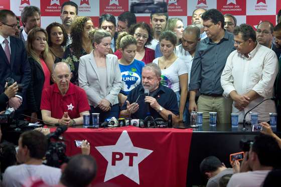 Former Brazilian President Luiz Inacio Lula da Silva (C) speaks during a press conference in Sao Paulo, Brazil, on March 4, 2016. Brazil's powerful ex-president Lula da Silva reacted Friday with defiance to his brief detention for questioning in a corruption probe, saying he feared no one. AFP PHOTO / NELSON ALMEIDA / AFP / NELSON ALMEIDA (Photo credit should read NELSON ALMEIDA/AFP/Getty Images)