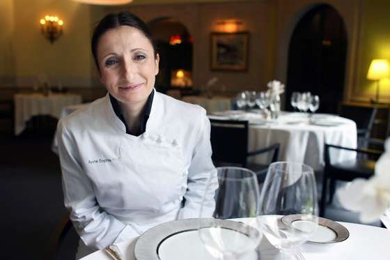 Valence, FRANCE: TO GO WITH AFP STORY : 'Woman chef among five newly honoured with three Michelin stars'. French chef Anne-Sophie Pic poses 21 February at the Maison Pic family restaurant, in Valence, southern France. Five chefs received a third Michelin star in the 2007 Guide, among them, Pic, who becomes the only woman in France to be granted with three stars. Anne-Sophie Pic, 37, who stems from a family of bespangled chefs, follows in the footsteps of only three other women to ever receive three Michelin stars: Eugenie Brazier and Marie Bourgeois in 1933, and Marguerite Bise in 1951. In addition to Pic, four other French chefs were awarded three stars: Yannick Alleno of Le Meurice; Frederic Anton of Le Pre Catelan; Pascal Barbot of L'Astrance, all in Paris; and Jacques Lameloise of Chagny in Saone-et-Loire. AFP PHOTO PHILIPPE MERLE (Photo credit should read PHILIPPE MERLE/AFP/Getty Images)