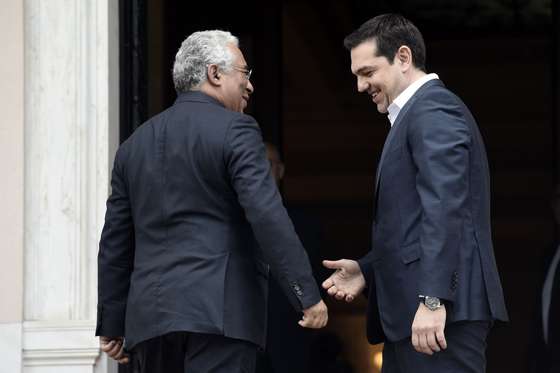 Greek Prime Minister Alexis Tsipras (R) welcomes his Portugese counterpart Antonio Costa prior to their meeting in Athens on April 11, 2016. / AFP / ARIS MESSINIS (Photo credit should read ARIS MESSINIS/AFP/Getty Images)