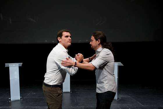 LEGANES, SPAIN - NOVEMBER 27: Ciudadanos (Citizens) leader Albert Rivera and Podemos (We can) leader Pablo Iglesias shake hands during a debate at Carlos III University of Madrid on November 27, 2015 in Leganes, Madrid province, Spain. Around a thousand students attended a debate with the candidates for the Presidency of Spain for Ciudadanos (Citizens), Albert Rivera and for Podemos (We can) Pablo Iglesias. There was also a few thousand further students who had to remain outside due to lack of space. The candidates of People's Party (PP) Mariano Rajoy and Socialist Party (PSOE) Pedro Sanchez were also invited, but failed to attend. According to the organizers, the students association Demos UC3M, this is the first ever debate between candidates for the Presidency of Spain that is held in a Public University. (Photo by Pablo Blazquez Dominguez/Getty Images)