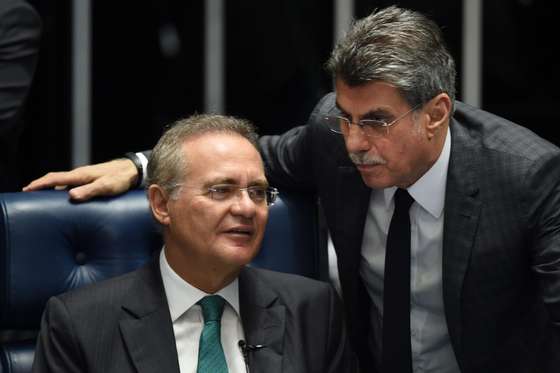 Senate President Renan Calheiros(L) and senator Romero Juca talk during debate Wednesday on suspending and impeaching President Dilma Rousseff in Brasilia on May 11, 2016.  The Senate opened debate that could bring down the curtain on 13 years of leftist rule in Latin America's biggest country. Even allies of Rousseff, 68, said she had no chance of surviving the vote.  / AFP / EVARISTO SA        (Photo credit should read EVARISTO SA/AFP/Getty Images)