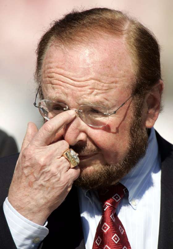 TAMPA, FL - NOVEMBER 21: Malcolm Glazer the principal owner of the Tampa Bay Buccaneers stands on the field before the start of the game against the San Francisco 49ers at Raymond James Stadium on November 21, 2004 in Tampa, Florida. Glazer is trying to buy the soccer team Manchester United. (Photo by Eliot J. Schechter/Getty Images)