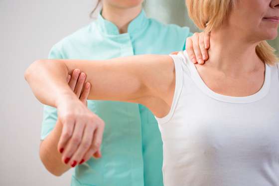 Joint - Body Part, Women, Physical Therapy, Alternative Therapy, Medical Exam, Physical Injury, Pain, Sitting, Examining, Massaging, Holding, Shoulder, Apron, Recovery, Effort, Healthcare And Medicine, Human Spine, Human Arm, Human Limb, Human Muscle, The Human Body, Massage Therapist, Patient, People, Medicine, Uniform, Stiff, 
