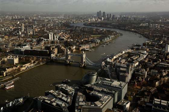 LONDON, ENGLAND - JANUARY 27: The More London commercial estate (foreground), Tower Bridge and Canary Wharf, seen from the View from The Shard on January 27, 2014 in London, England. A study has found that one in three 22-30 year olds are leaving their hometowns to move to the capital, which creates ten times as many private sector jobs as any other city. (Photo by Matthew Lloyd/Getty Images)