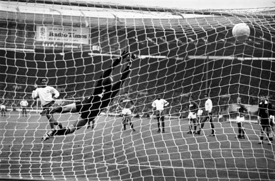 29th July 1966: Portugal's Eusebio (white shirt) hammers his penalty kick past Russia's Lev Yashin, to put his country in the lead during the World Cup third place play off game at Wembley Stadium. (Photo by Keystone/Getty Images)