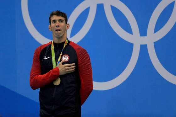 RIO DE JANEIRO, BRAZIL - AUGUST 11: Gold medalist Michael Phelps of the United States poses on the podium during the medal ceremony for the Men's 200m Individual Medley Final on Day 6 of the Rio 2016 Olympic Games at the Olympic Aquatics Stadium on August 11, 2016 in Rio de Janeiro, Brazil. (Photo by Mike Ehrmann/Getty Images)