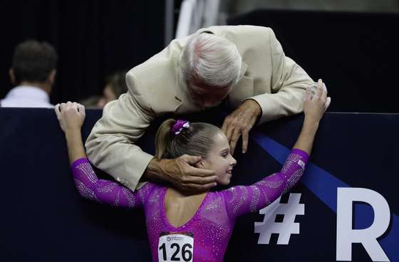 SAN JOSE, CA - JULY 10: Ragan Smith is congratulated by Bela Karolyi after she competed on the balance beam during Day 2 of the 2016 U.S. Women's Gymnastics Olympic Trials at SAP Center on July 10, 2016 in San Jose, California. (Photo by Ezra Shaw/Getty Images)