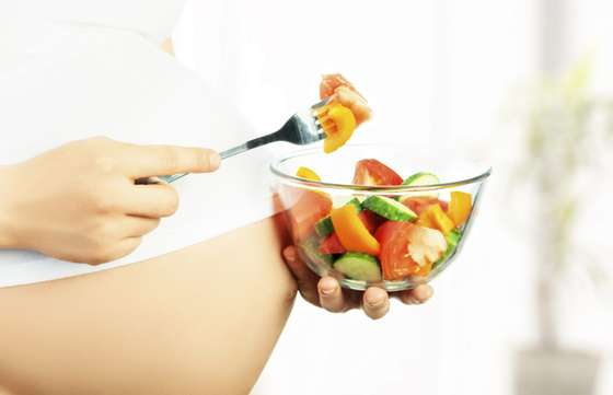 Abdomen, Adult, Anticipation, Baby, Beautiful, Care, Caucasian, Cheerful, Dieting, Eating, Enjoyment, Family, Female, Food, Food And Drink, Fork, Freshness, Happiness, Healthy Lifestyle, Home Interior, Human Hand, Human Pregnancy, Indoors, Love, Mother, One Person, Parent, People, Prenatal Care, Salad, The Human Body, Vegetable, Vitamin Pill, Waiting, White, Women, Young Adult, 