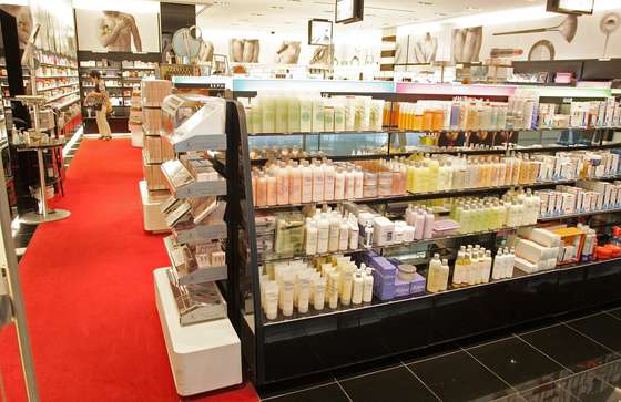 SAN FRANCISCO - AUGUST 11: A woman browses through fragrances at Sephora cosmetics store in the international terminal at San Francisco International Airport August 11, 2006 in San Francisco, California. Businesses at airports are bracing for a financial hit after the Transportation Security Administration imposed a ban on all liquids and gels aboard flights as part of the Department of Homeland Security raising the terrorism threat alert to highest level of "red" on August 10, for commercial flights from Britain to the United States. (Photo by Justin Sullivan/Getty Images)
