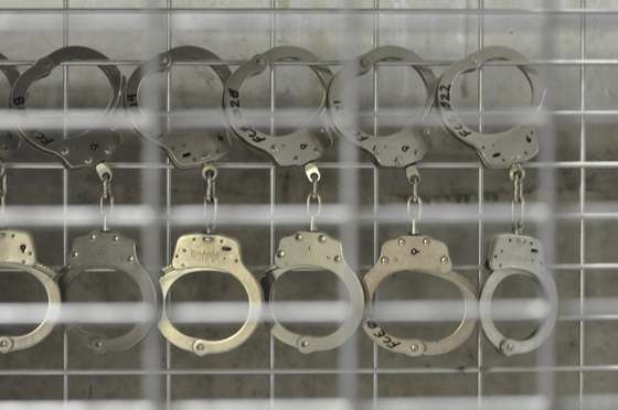 In this photo, reviewed by a US Department of Defense official, handcuffs hang in Camp 6 high-security detention facility at Guantanamo Bay US Naval Base, Cuba, on April 27, 2009. Canadian Guantanamo detainee Omar Khadr facing a US military tribunal for alleged war crimes has reportedly turned down a plea offer that would have meant five years in prison. POOL/Michelle Shephard = IMAGE REVIEWED BY THE US DEPARTMENT OF DEFENSE = (Photo credit should read MICHELLE SHEPHARD/AFP/Getty Images)