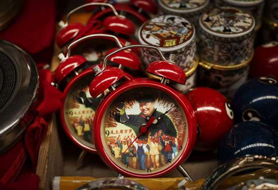 BEIJING, CHINA - SEPTEMBER 07: Alarm clocks showing the late Chinese leader Mao Zedong are seen for sale at a vendor's stand at a market on September 7, 2014 in Beijing, China. Chairman Mao, a Communist revolutionary and founding father of the People's Republic of China, led the country until his death September 9, 1976. Mao's ideology, though at times controversial, still wields influence over the leadership of modern China. (Photo by Kevin Frayer/Getty Images)