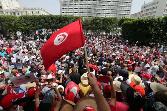 epa09285695 Supporters of the Free Destourian Party (Free Constitutional Party) shout slogans during protest during a demonstration against political Islamist party Ennahda and the government in Tunis, Tunisia, 19 June 2021. According to the President of the Free Destourian Party, Abir Moussi, "The national dialogue is useless because the political class is precisely the cause of all the problems. Those who are for the dialogue aim only to artificially prolong the duration of a system which allows them to remain in power where in facade opposition". EPA/MOHAMED MESSARA