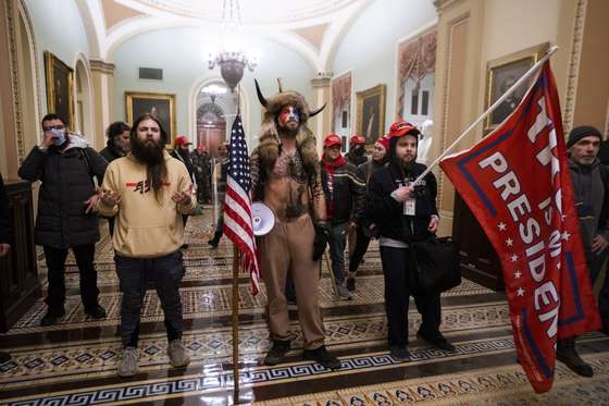 epa09664285 (14/24) (FILE) - Supporters of US President Trump stand by the door to the Senate chambers after they breached the US Capitol security in Washington, DC, USA, 06 January 2021 (reissued 03 January 2021). Following the November 2020 US presidential election, a tone set by supporters of defeated US President Donald Trump escalated further. Trump, who was refusing to concede the victory of Joe Biden, claiming voter fraud and rigged elections, told supporters and white nationalist extreme-right group Proud Boys to respectively 'Stop the Steal' and to 'stand back and stand by'. His social media accounts were suspended and the alt-right platform Parler gained in user numbers. On 06 January 2021, incumbent US vice president Pence was due to certify the Electoral College votes before Congress, the last step in the process before President-elect Biden was to be sworn in. In the morning, pro-Trump protesters had gathered for the so-called Save America March. Soon after Trump finished his speech at the Ellipse, the crowd marched to the Capitol. The attack had begun. Rioters broke into the Capitol building where the joint Congress session was being held. Lawmakers barricaded themselves inside the chambers and donned tear gas masks while rioters vandalized the building, some even occupying offices such as House Speaker Pelosi's. Eventually in the evening the building was cleared from insurrectionists, and the Congress chambers reconvened their session, confirming Joe Biden as the winner of the 2020 US presidential election. In the aftermath, more than 600 people were charged with federal crimes in connection to the insurgency, and close Trump aides such as Steve Bannon, Mark Meadows and Roger Stone were subpoenaed by the House select committee investigating the attack. Trump himself was acquitted by the Senate in his second impeachment trial, this time for "inciting an insurrection". EPA/JIM LO SCALZO ATTENTION: This Image is part of a PHOTO SET *** Loc