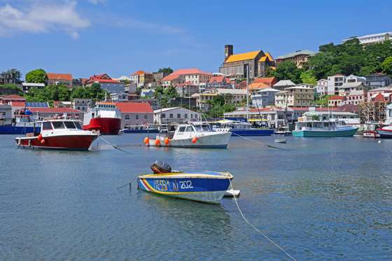 Waterfront and Roman Catholic Cathedral of the capital city St. George's on the west coast of the island of Grenada in the Caribbean Sea. (Photo by: Marica van der Meer