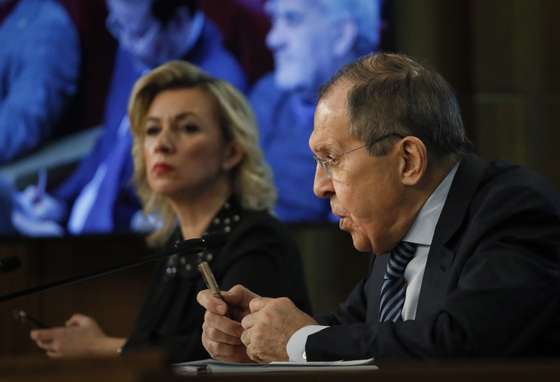 epa10413016 Russian Foreign Minister Sergei Lavrov (R) and Foreign Ministry's Spokeswoman Maria Zakharova (L) attend an annual news conference in Moscow, Russia, 18 January 2023. Lavrov gave a press conference on the results of Russian diplomacy in 2022.  EPA/YURI KOCHETKOV