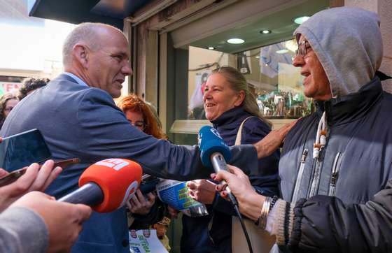 The secretary-general of the Portuguese Communist Party (PCP) Paulo Raimundo (L) speaks with people during a United Democratic Coalition (CDU) campaign, as part of the campaign legislative elections on 10 March, in Setubal, 27 February 2024. On January 15, the President of the Republic decreed the dissolution of parliament and the calling of early legislative elections for March 10, following the resignation of the Prime Minister, Antonio Costa, presented on 07th November 2023, due to Operation Influencer, and immediately accepted by the President of the Republic. RUI MINDERICO/LUSA