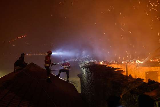 Firefighters fight a forest fire in Zimao, Vila Pouca de Aguiar, Portugal, 16 September 2024. The situation has worsened in the fire in Vila Pouca de Aguiar, which is approaching the village of Vila MeÃ£, said the mayor today, who asked for more resources to fight the three fires in the municipality. 99 operational and 32 vehicles are fighting the forest fire. PEDRO SARMENTO COSTA/LUSA