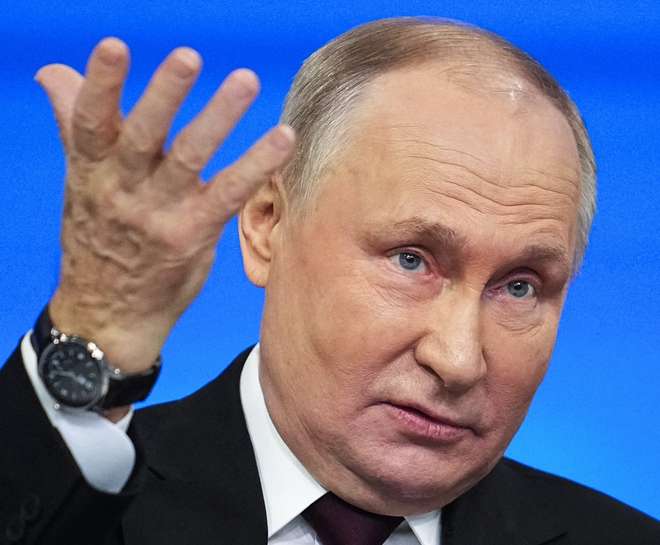 epa11028325 Russian President Vladimir Putin gestures as he answers questions during his annual press conference with Russian federal, regional, and foreign media at the Gostiny Dvor forum hall in Moscow, Russia, 14 December 2023. Russian President Vladimir Putin on 14 December holds his end-of-year press conference, followed by the 'Direct Line with Vladimir Putin' televised event, where he will answer citizens' questions focusing on domestic issues. The President's Big Press Conference is an annual event that has been held since 2001. This year the format is combined 'Direct Line' (questions from citizens) and 'Big Press Conference' (questions from journalists). The event takes place months before the presidential election scheduled for 17 March 2024, in which Putin decided to run for re-election.  EPA/ALEXANDER ZEMLIANICHENKO / POOL