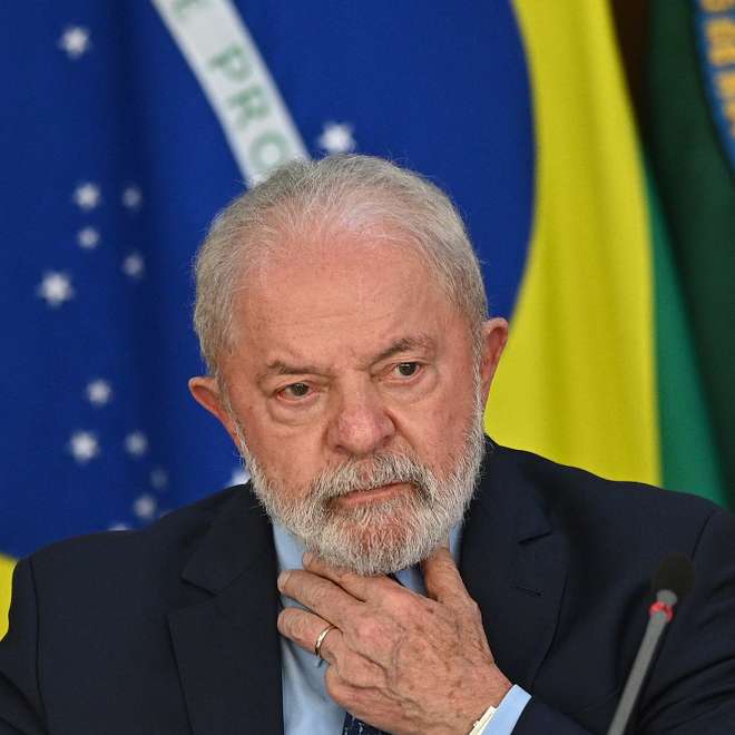 epa10514295 The President of Brazil, Luiz Inacio Lula da Silva, reacts during the launch of the 'Manos a la Obra' platform, at the Planalto Palace, in Brasilia, Brazil, 10 March 2023. Lula da Silva launched this 10 March a digital platform that will serve to identify and resume the thousands of works that are stopped throughout the country, in a context of economic slowdown.  EPA/Andre Borges