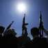 epa13286971 Houthi fighters hold up their weapons during a campaign to mobilize more fighters, in Sana'a, Yemen, 07 October 2026. As fighting between the Houthis and the Saudi-led coalition escalates, the head of Yemen's internationally recognized government, Rashad al-Alimi, announced in an address on 04 October the launch of military operations to retake remaining territory held by the Houthis.  EPA/YAHYA ARHAB