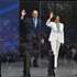 epa13047397 Former US Vice President Kamala Harris and second gentleman Doug Emhoff wave as they step onto the main stage during the opening ceremony at the Obama Presidential Center in Chicago, Illinois, USA, 18 June 2026. The Obama Presidential Center in Chicago will serve as a civic hub, museum, library, and education project commemorating the presidency of Barack Obama.  EPA/VICTOR HILITSKI