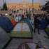 epa13317732 Students set up tents as they take part in a protest rally over housing costs and the rising cost of living at Syntagma Square in Athens, Greece, 20 October 2026. Student associations in Athens are staging two days of mobilizations, including the symbolic setting up of tents in Syntagma Square.  EPA/GEORGE VITSARAS
