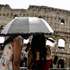 epa13196797 Tourists cover themselves from the sun with umbrellas as they visit the Colosseum in Rome, Italy, 28 August 2026. Italy’s Ministry of Health issued a red-level heat alert for Rome and multiple major cities across the country, warning of extreme temperatures.  EPA/ANGELO CARCONI