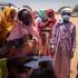 epa11275411 Workers of the World Food Programme (WFP) and Red Cross attend to refugees that have just arrived to Chad from Darfur, in a refugee camp in Adre, Chad, on the border with Sudan, 12 April 2024.  Most of the refugees are women and children fleeing the hunger crisis because of the war which started on 15 April 2023. According to the UNHCR in March 2024, in one year more than 500,00 Sudanese refugees, mainly from Darfur region, have crossed into Chad looking for safety, 90 percent of them are women and children. As different humanitarian crises are unfolding in other parts of the world, both the UN and NGOs like Doctors Without Borders/Médecins Sans Frontières (MSF) keep appealing for more aid to reach Sudan and avoid a looming famine situation in the already strained socio-economic context of Chad.  EPA/STRINGER