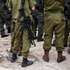 epa10989464 Israeli soldiers stand guard near the security fence along the border with the Gaza Strip during a press visit at Kfar Aza Kibbutz, southern Israel, 22 November 2023. The kibbutz, located near the Gaza border, was the scene of an Hamas attack on 07 October which resulted in the deaths of dozens of Israelis. More than 12,700 Palestinians and at least 1,200 Israelis have been killed, according to the Israel Defense Forces (IDF) and the Palestinian health authority, since Hamas militants launched an attack against Israel from the Gaza Strip on 07 October, and the Israeli operations in Gaza and the West Bank which followed it.  EPA/CHRISTOPHE PETIT TESSON
