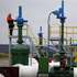 epa00900068 A worker stands on a platform at the first pump station on Belarus territory of the Druzhba pipeline, near the village of Bobovichi, about 330 km southeast of Minsk, Thursday, 11 January 2007. One of two German refineries hit by the suspension of Russian oil deliveries started receiving supplies again Thursday after Russian pipeline monopoly Transneft resumed pumping.  A spokesman for the PCK refinery in Schwedt said crude oil from the Druzhba (friendship) pipeline through Belarus started reaching the processing facility on Thursday morning.  EPA/ANDREI LIANKEVICH
