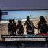 epa13294863 A person watches a television broadcast showing Saudi-backed Yemeni troops at a position on the Red Sea coast near the Bab al-Mandeb Strait in Sana'a, Yemen, 10 October 2026. The Saudi-led coalition supporting the Yemeni government announced that it had launched a large-scale military operation aimed at weakening the Houthis' ability to launch aerial attacks against Saudi territory and resist ground offensives by Yemeni government forces seeking to retake Houthi-controlled areas.  EPA/YAHYA ARHAB