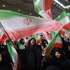 epaselect epa12749570 Iranian women wave Iran's national flags during  a memorial ceremony for those killed in anti-government protests earlier last month, at the Mosallah mosque in Tehran, Iran, 17 February 2026. Following US military threats against Iran, Iranian supreme leader Ayatollah Ali Khamenei said on 17 February 2026, that the US and its president could not destroy Iran, adding that the 'strongest military force in the world may at times be struck so hard that it cannot get up again'  EPA/ABEDIN TAHERKENAREH