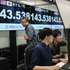 epa11526616 Dealers work next to monitors showing the foreign exchange rate between the Japanese yen and US dollar in Tokyo, Japan, 05 August 2024. The Tokyo stock exchange plunged more than 11 percent, with the Japanese yen rising against the US currency, after a drop on Wall Street of more than 600 points.  EPA/KIMIMASA MAYAMA