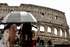 epa13196797 Tourists cover themselves from the sun with umbrellas as they visit the Colosseum in Rome, Italy, 28 August 2026. Italy’s Ministry of Health issued a red-level heat alert for Rome and multiple major cities across the country, warning of extreme temperatures.  EPA/ANGELO CARCONI