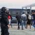 epa13295934 A Spanish National Police officer monitors the clearing of a migrant camp set up in the esplanade in front of the old El Guano factory in Ceuta, Spain, 11 October 2026. Police carried out the new operation just over 48 hours before an official visit by the Spanish royal couple to the Spanish enclave in North Africa.  EPA/Reduan BEST QUALITY AVAILABLE